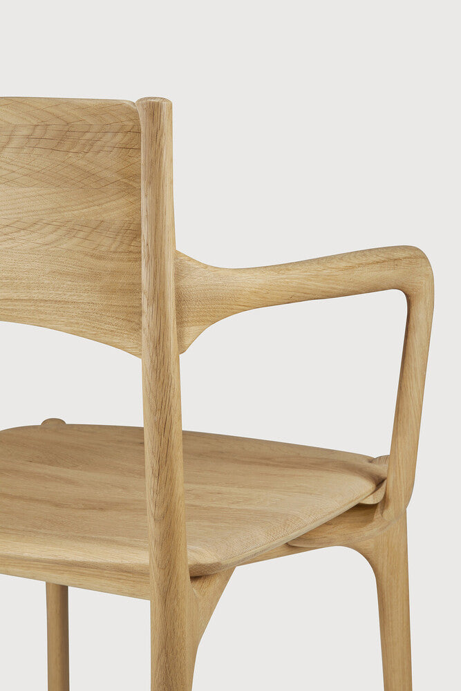 Ethnicraft Pi Dining Chair in oak styled in a dining room