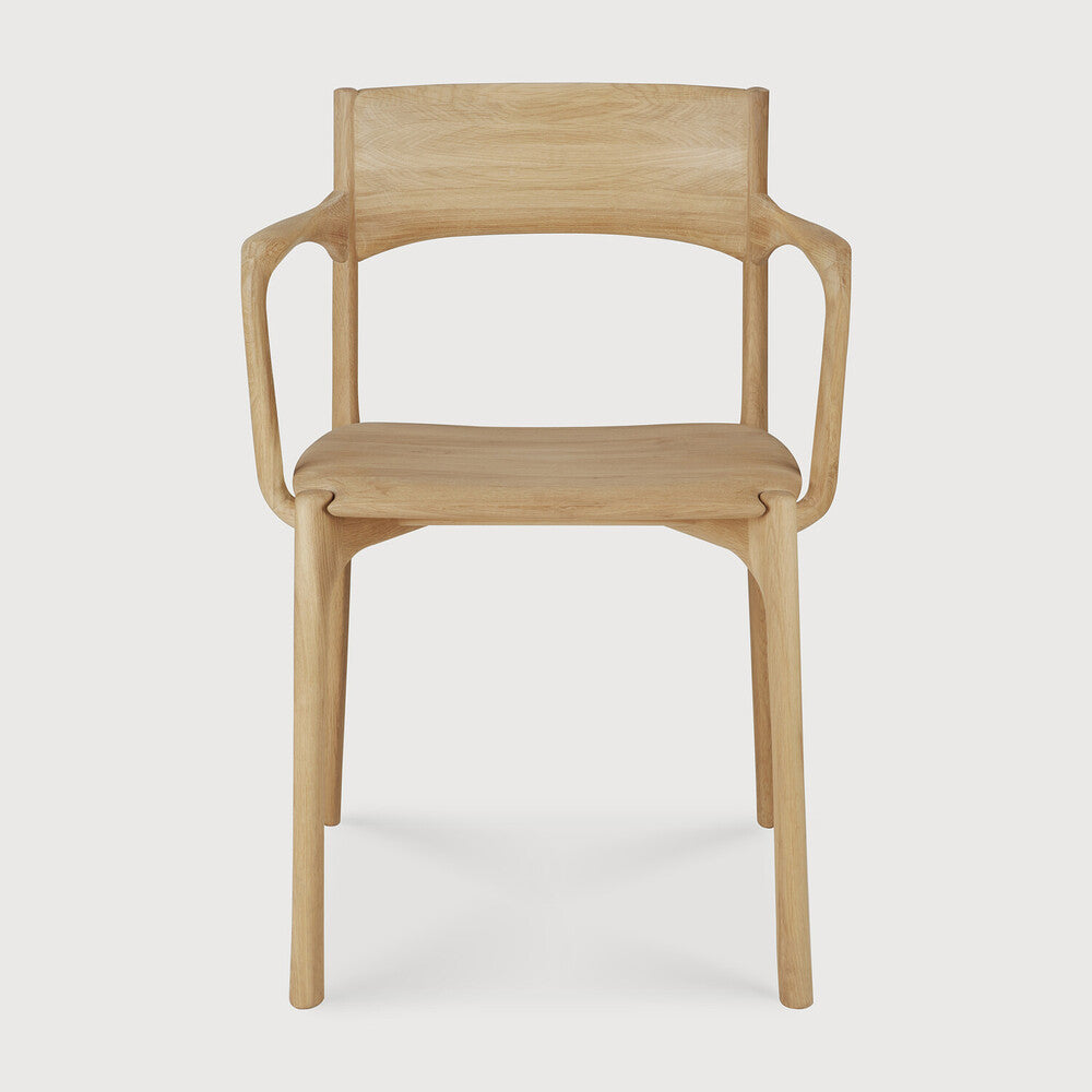 Ethnicraft Pi Dining Chair in oak styled in a dining room