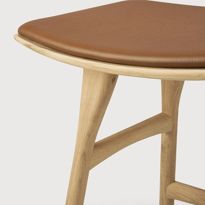 Ethnicraft Osso Bar Stool in oak styled in a dining room