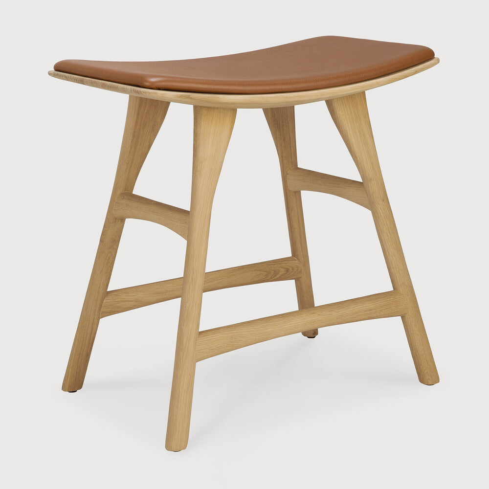 Ethnicraft Osso Stool in oak styled in a dining room