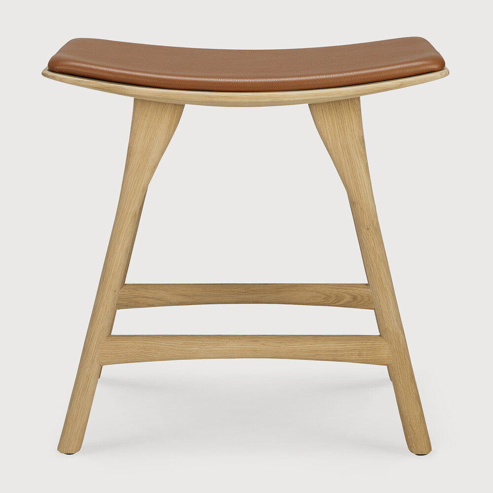 Ethnicraft Osso Bar Stool in oak styled in a dining room