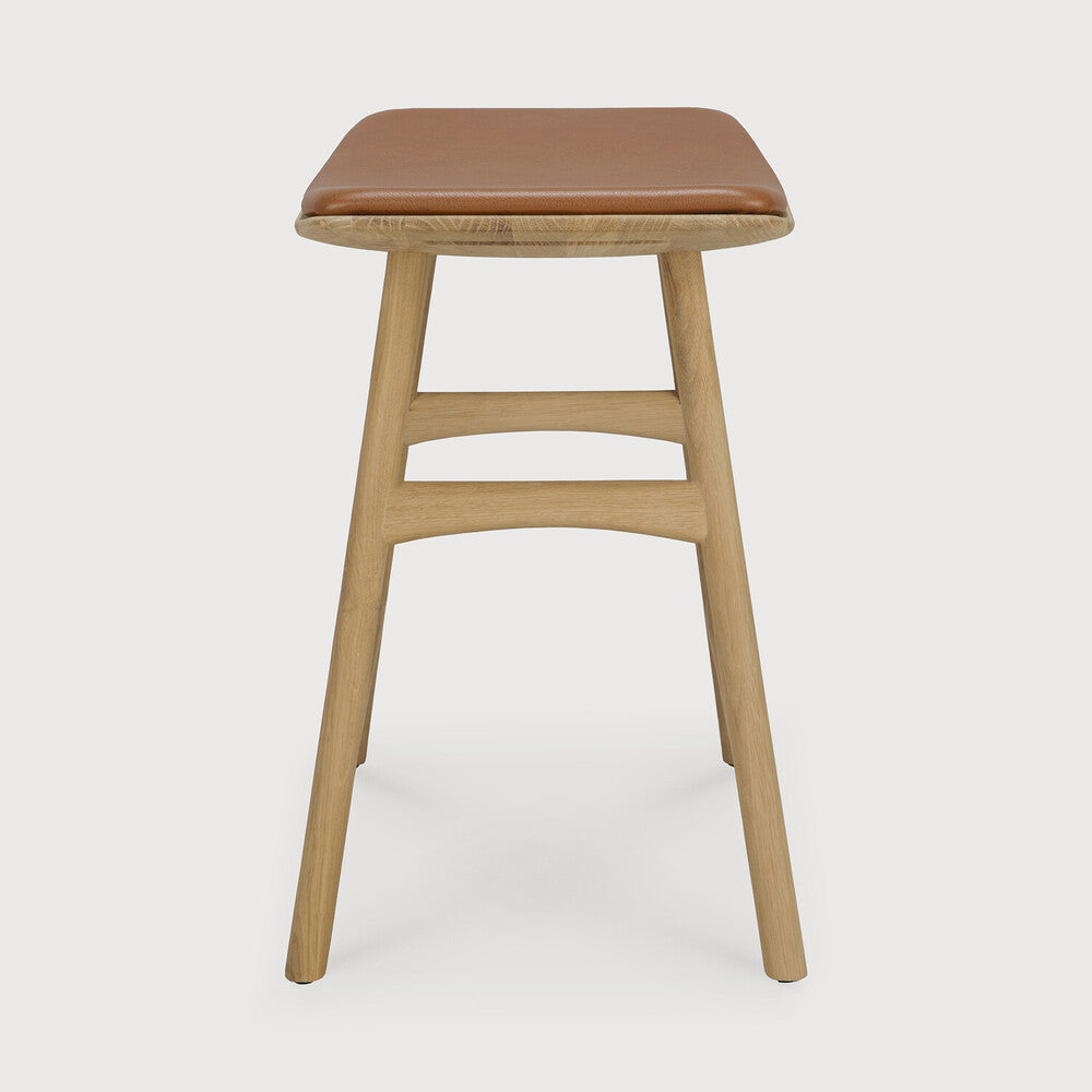 Ethnicraft Osso Bar Stool in oak styled in a dining room