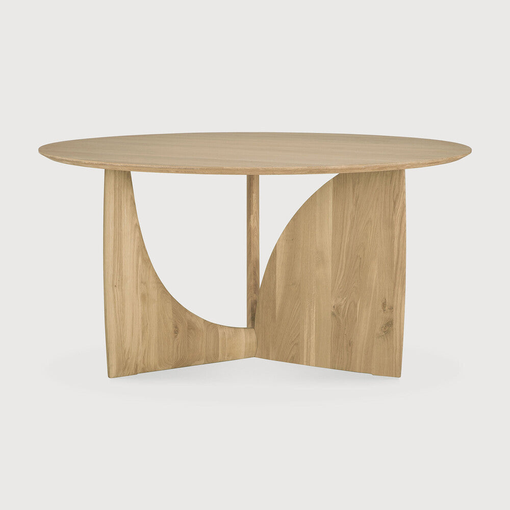Ethnicraft Geometric Round Dining Table in oak styled in a dining room
