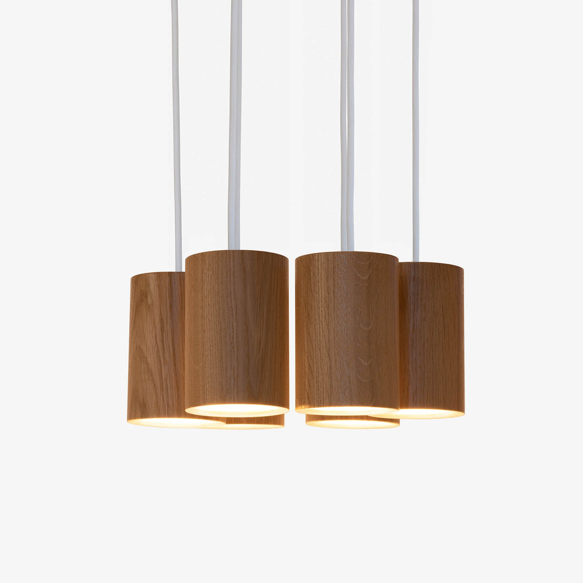 Case Solid Six Pendant Cluster in Oak, cylinders hung level, solid oak