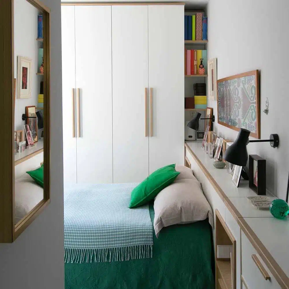 Anglepoise Type 75 wall light in Jet Black beside a bed in a fitted bedroom