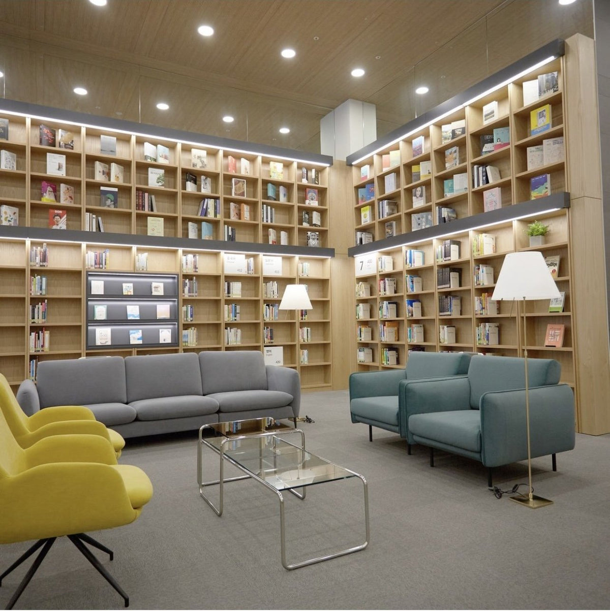 Luceplan Lady Costanza Floor Lamps in a double-height library