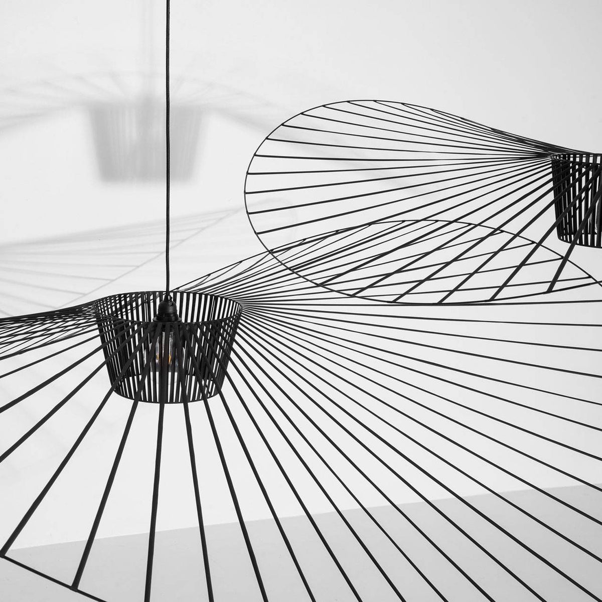 Detail of Petite Friture Vertigo Pendant in Black showing the hand-laid polyurethane tape