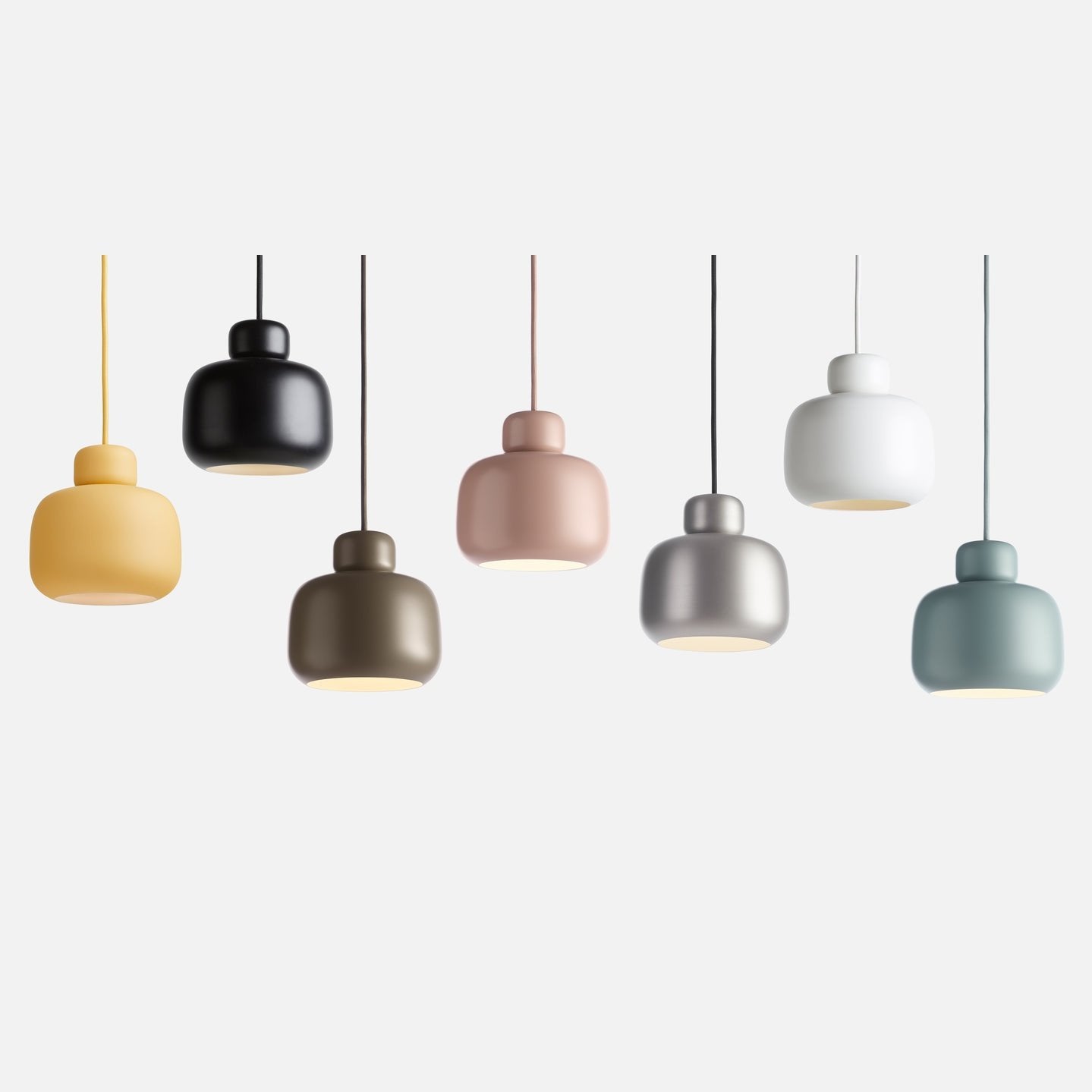Stone pendant lamps multiple colors by Woud, decorative lighting crafted by Comosum