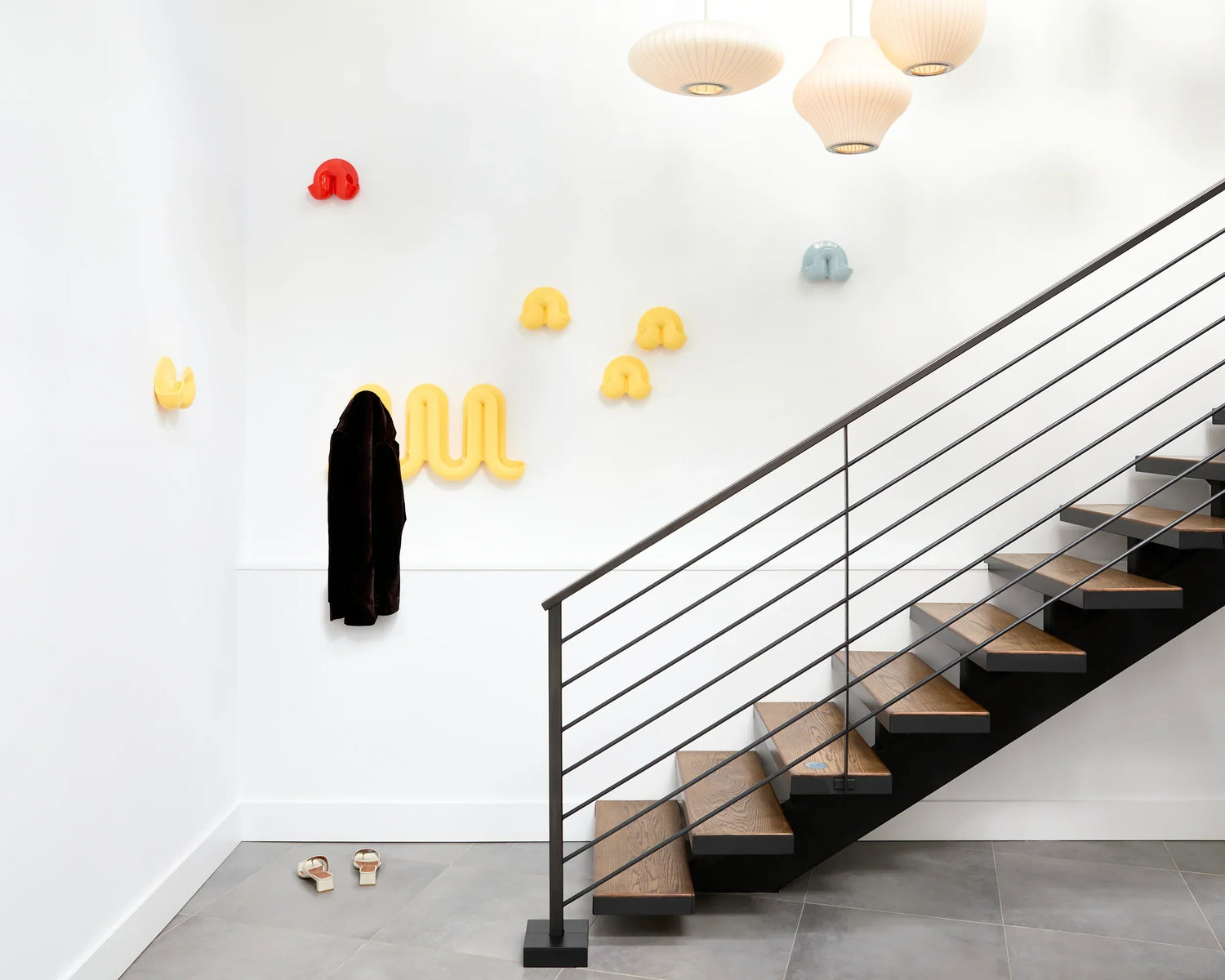 Heller Swell wall organizers and catchalls mounted in a hallway