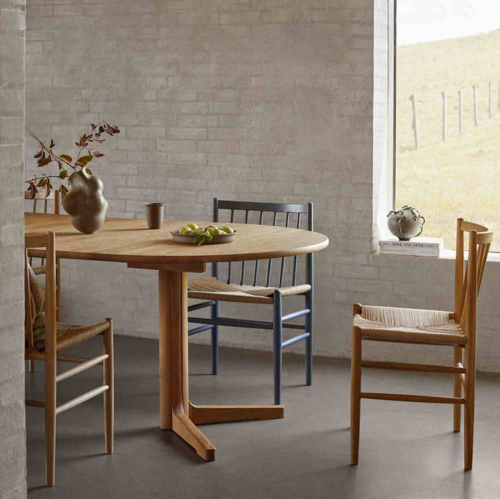FDB Møbler J80 paper-cord dining chairs in oak and painted beech around a round oak dining table