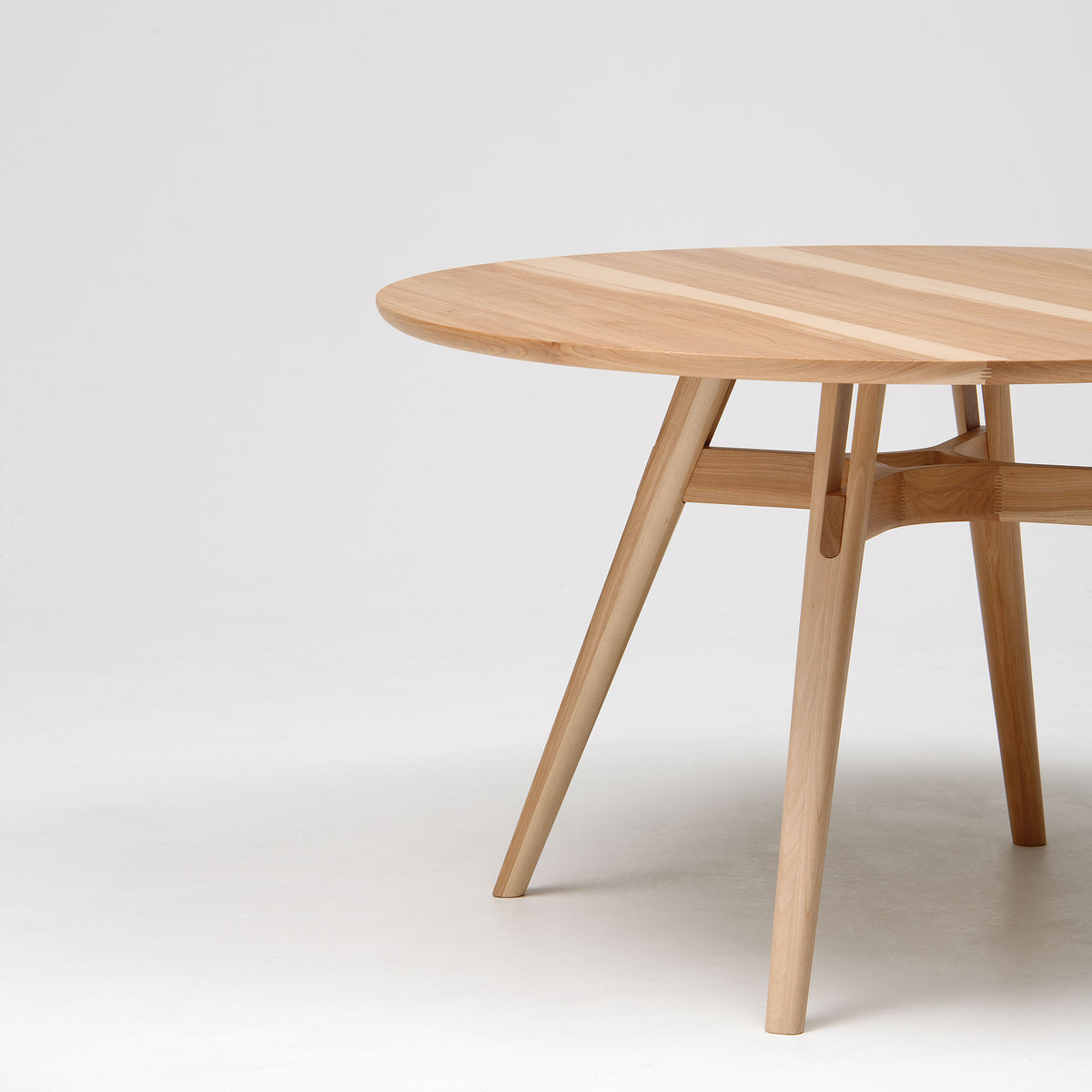 CondeHouse YON round table in natural Japanese birch in a dining room (shown in the 47 1/4 in size)