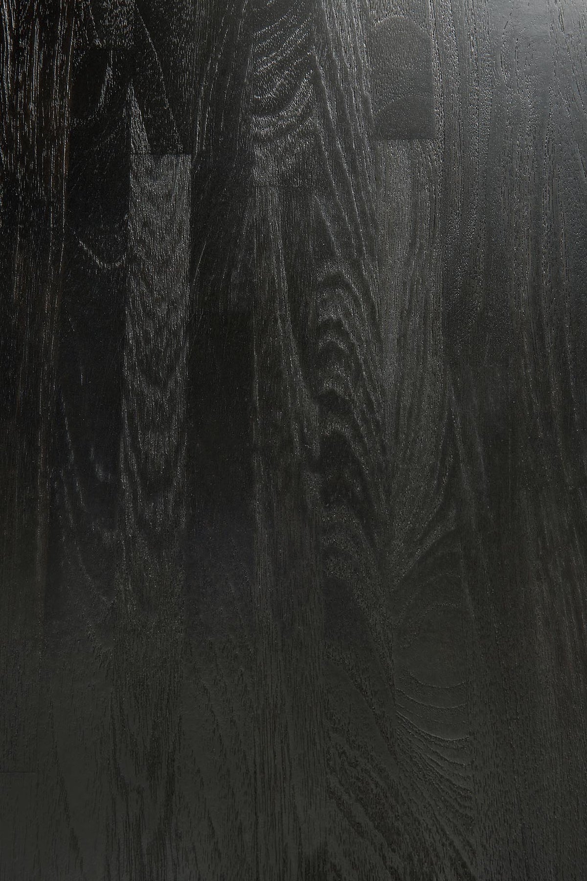 Detail of Ethnicraft Fin Side Table showing the teak grain under the black varnished finish