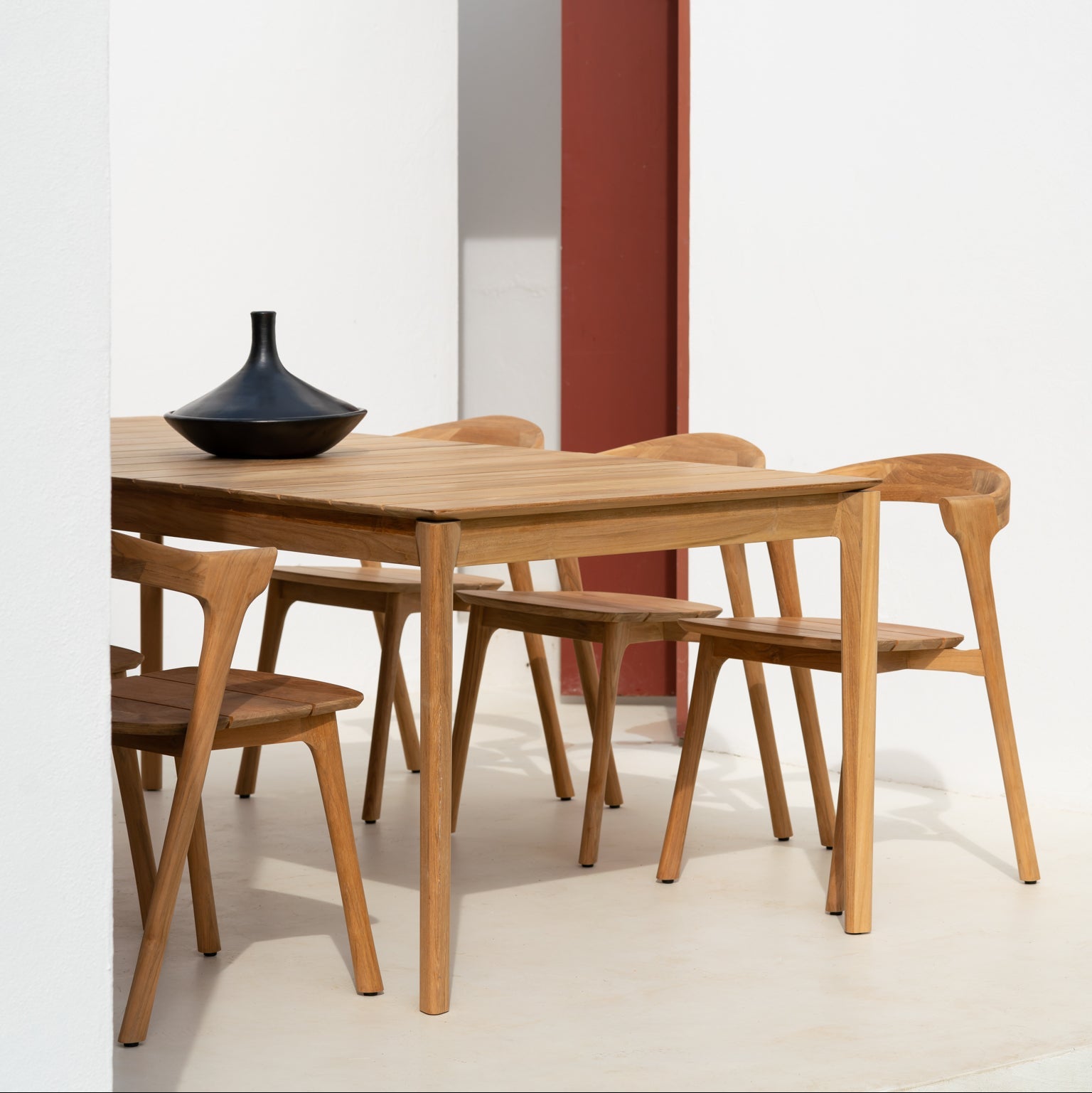 Ethnicraft Bok Outdoor Dining Chair in teak styled in a dining room