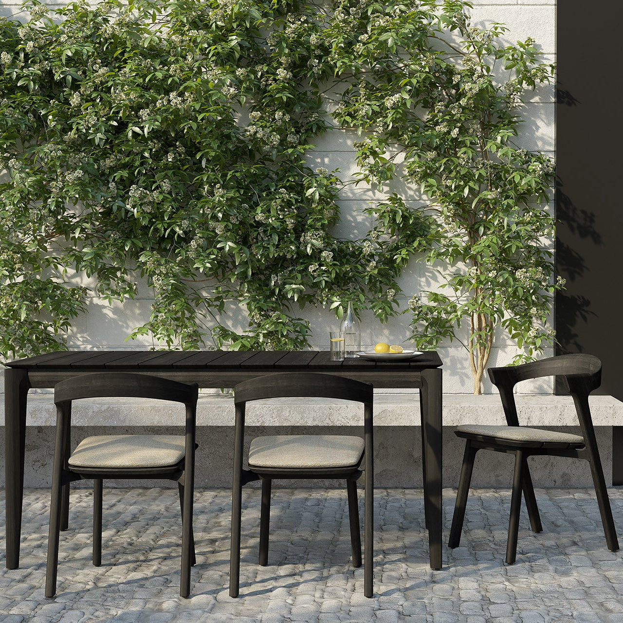 Ethnicraft Bok Outdoor Dining Chair styled in a dining room