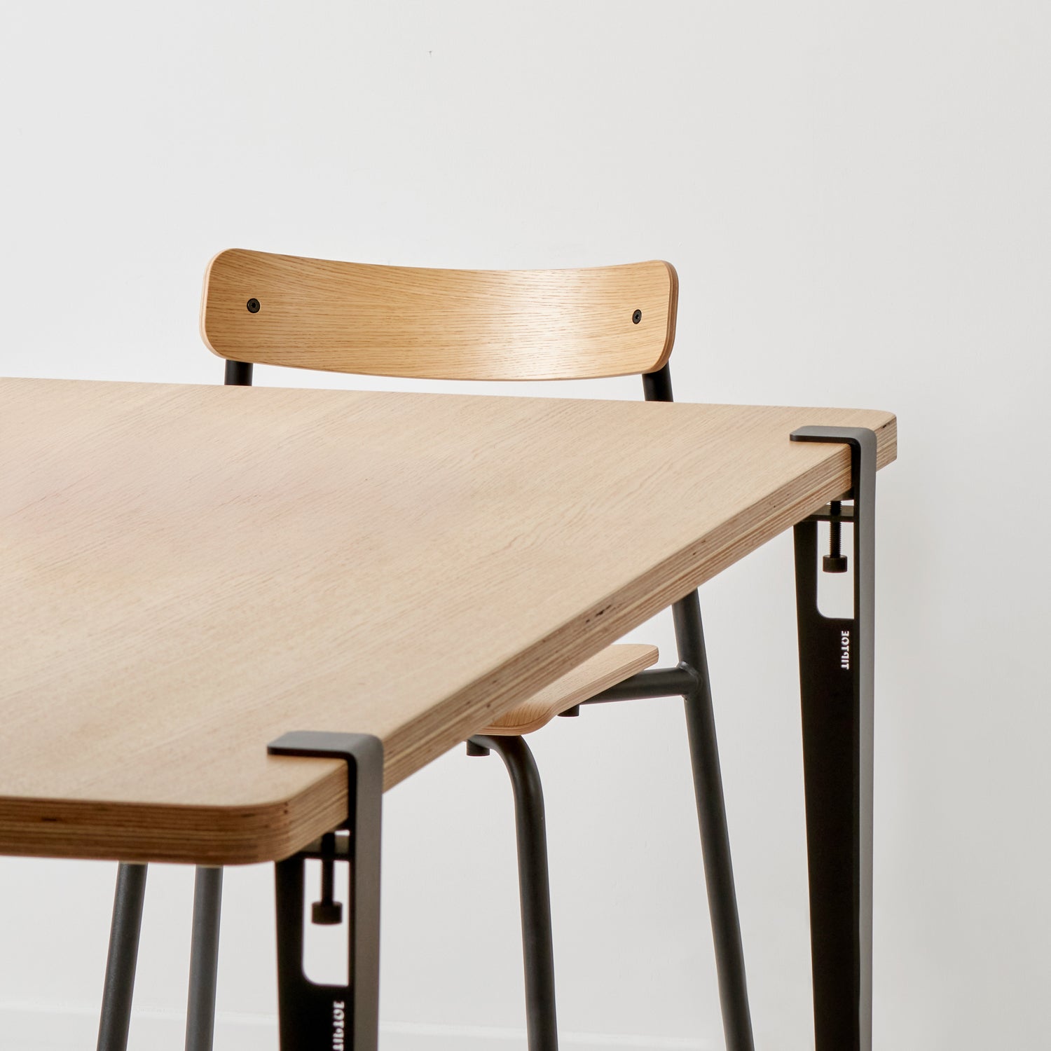 Tiptoe Dining Table with Eco-Certified Wood Top lifestyle photograph