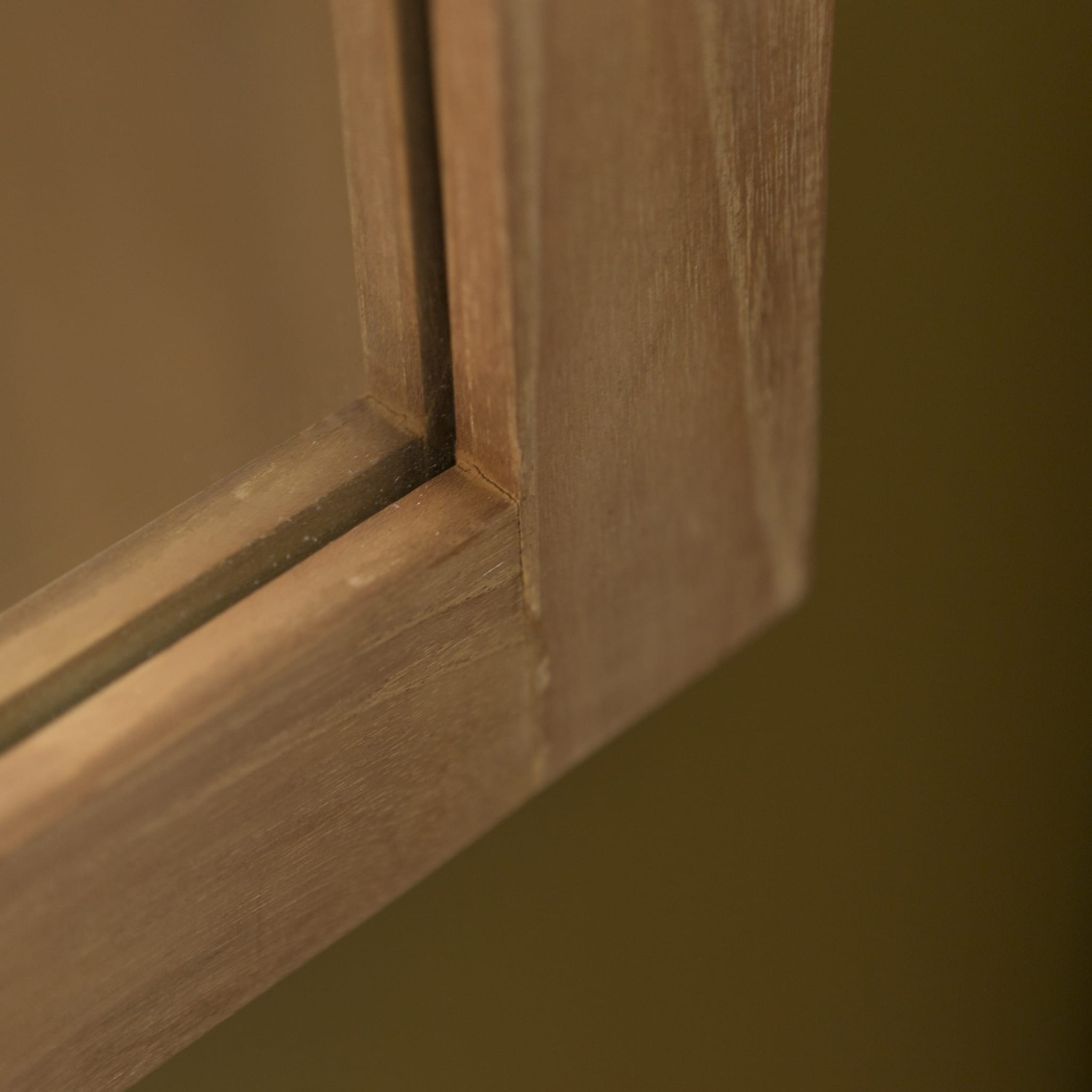 Bahya teak mirror hung above a bathroom vanity