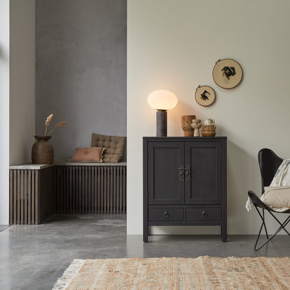Tikamoon Thaki Black cabinet in black-painted solid pine in a living room