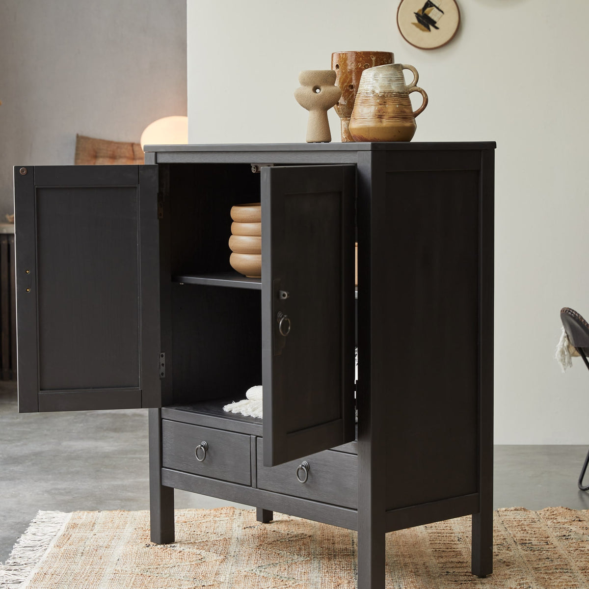 Tikamoon Thaki Black cabinet with both doors open and an inside shelf