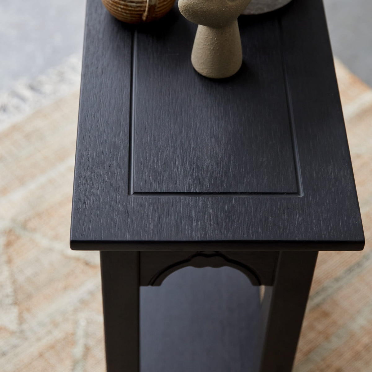 Tikamoon Thaki Black console table in solid pine, close-up of the black finish