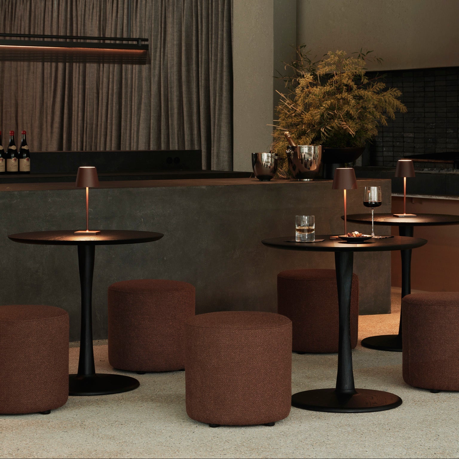 Ethnicraft Barrow Pouf styled in a dining room