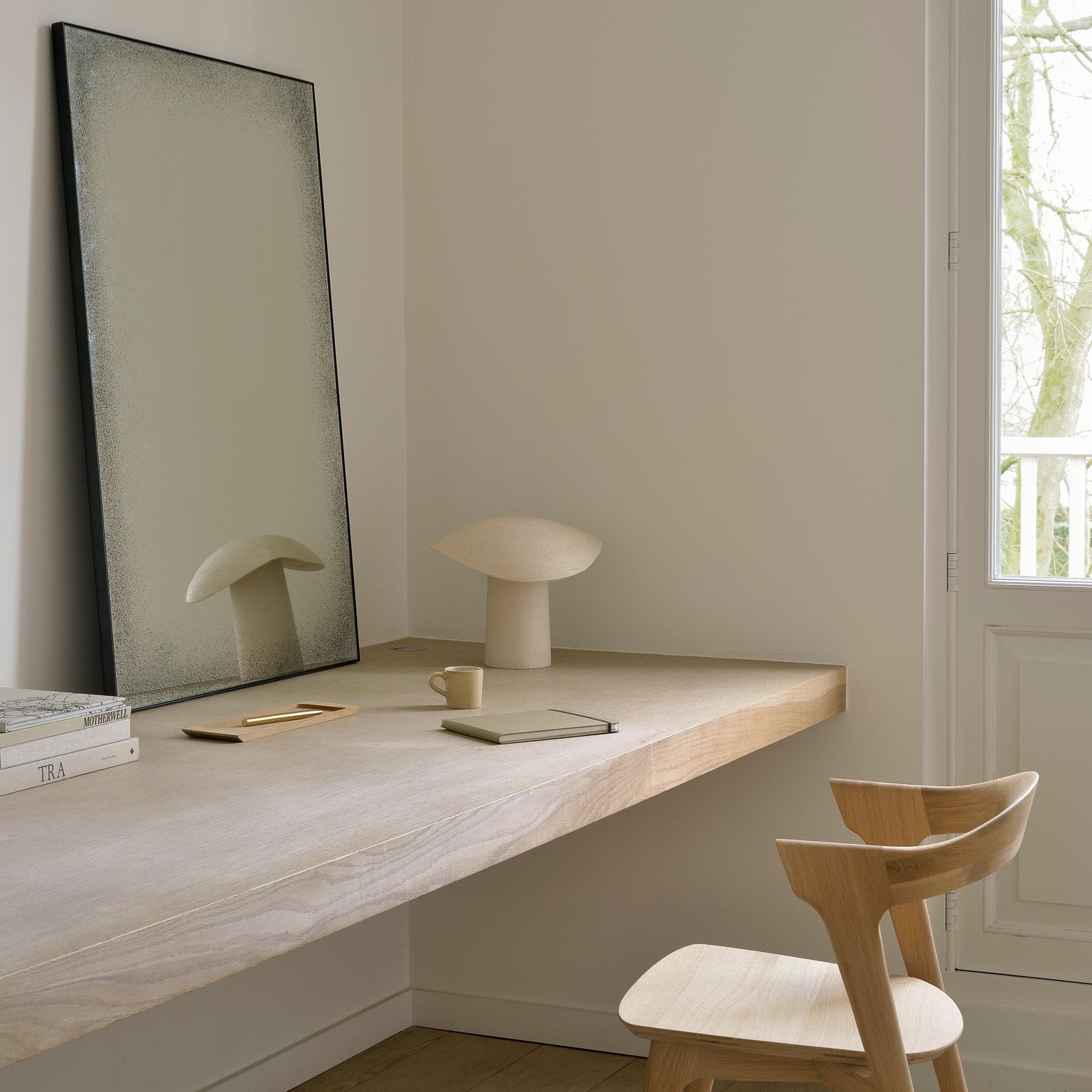 Ethnicraft Aged Floor Mirror styled in a dining room
