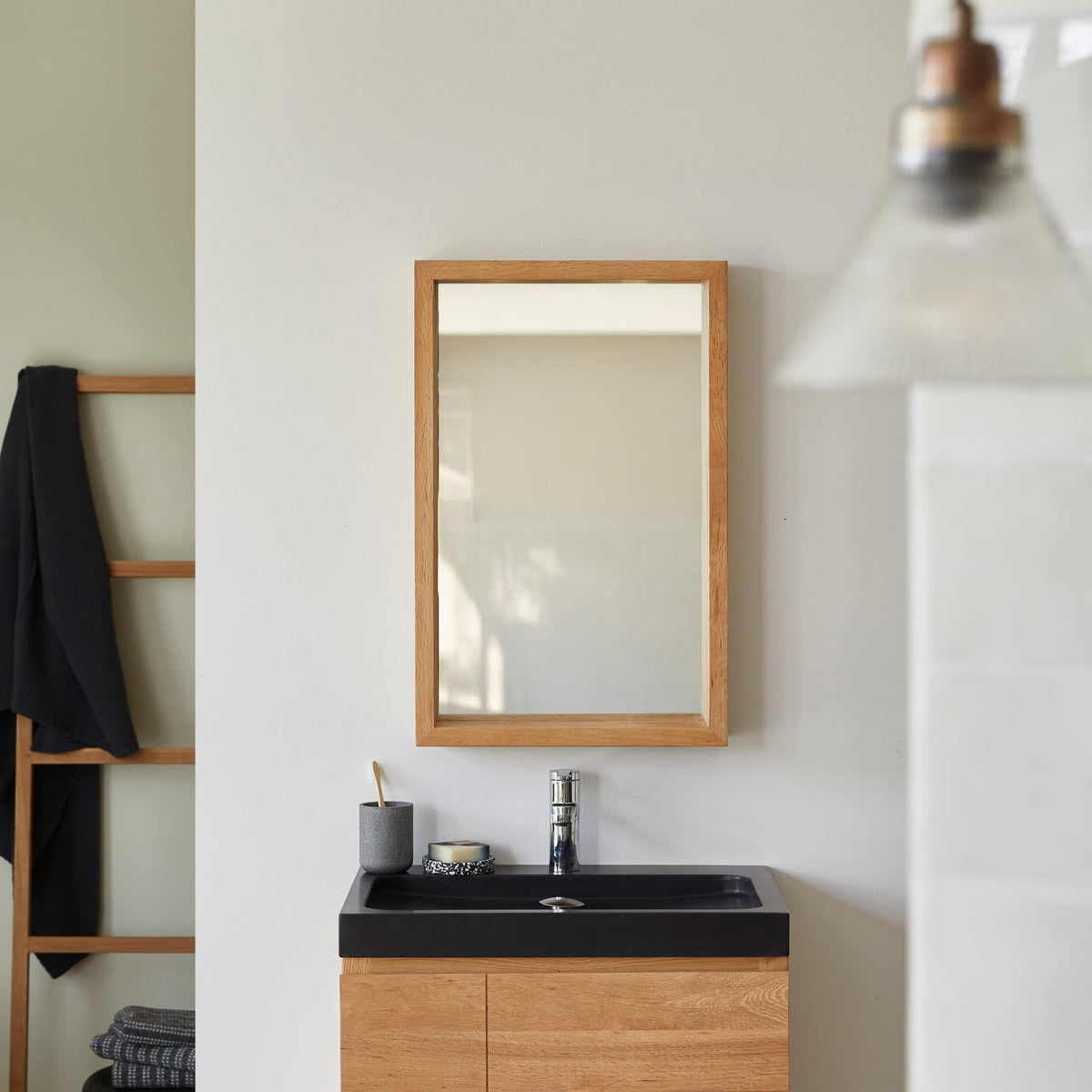 Tikamoon Easy oak wall mirror, angled view showing the depth of the frame