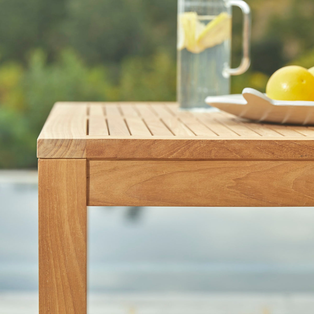 Tikamoon Teo teak table, detail of the leg and frame