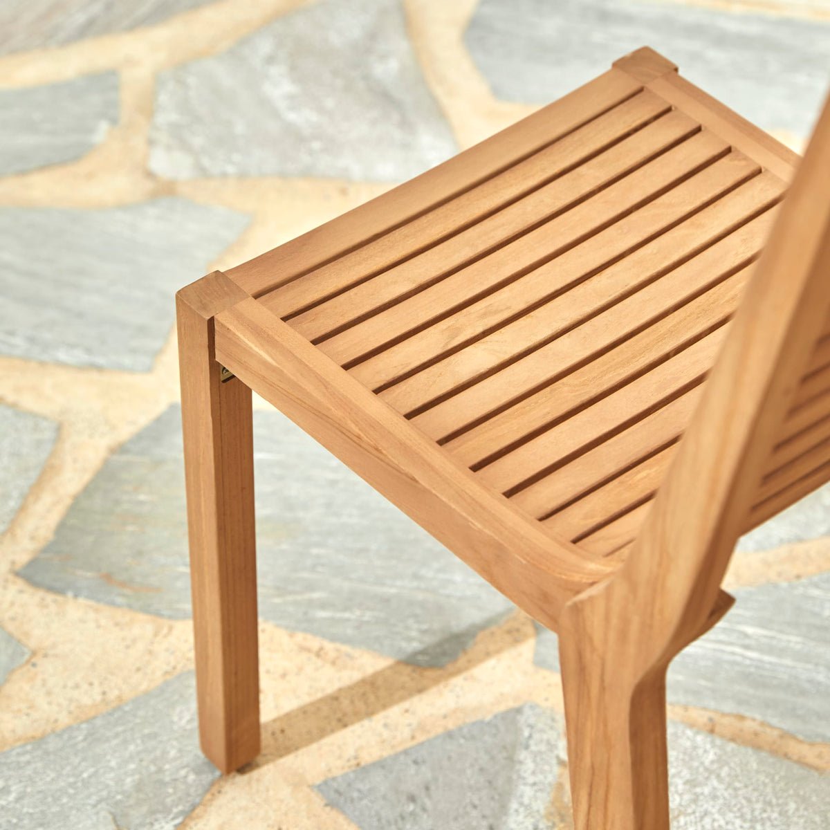 Tikamoon Teo outdoor dining chair in solid teak, rear view of the slatted back