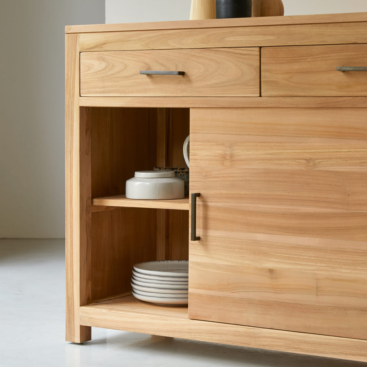 Tikamoon Maë sideboard in solid teak, front view showing two cabinets and two drawers