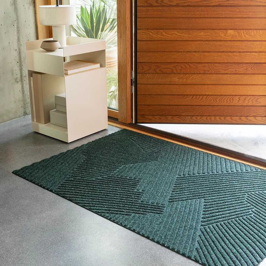 Heymat Strå All Weather Doormat doormat in Green styled in an entryway, recycled PET yarn Norwegian design
