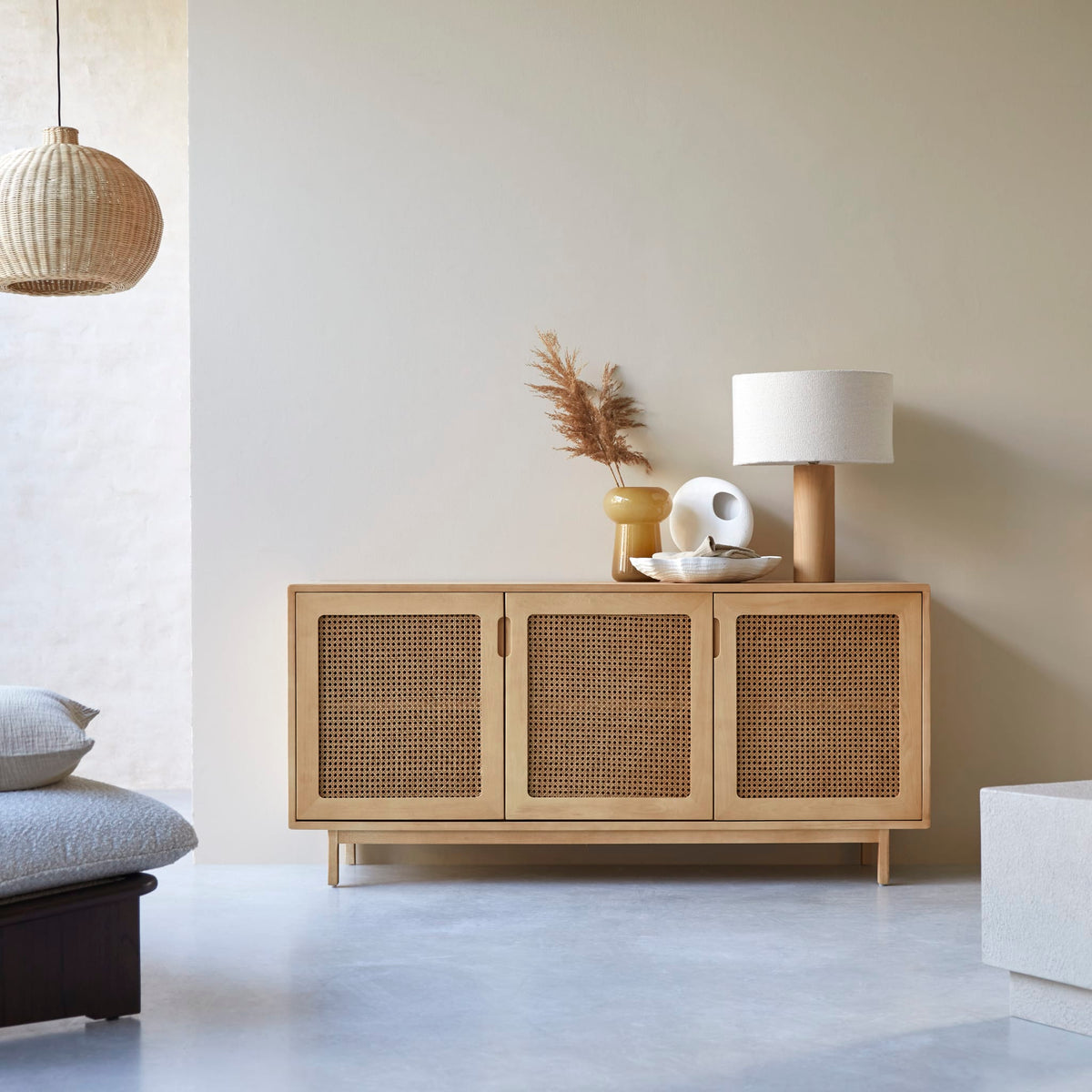 Tikamoon Luis sideboard in solid elm and cane, angled view