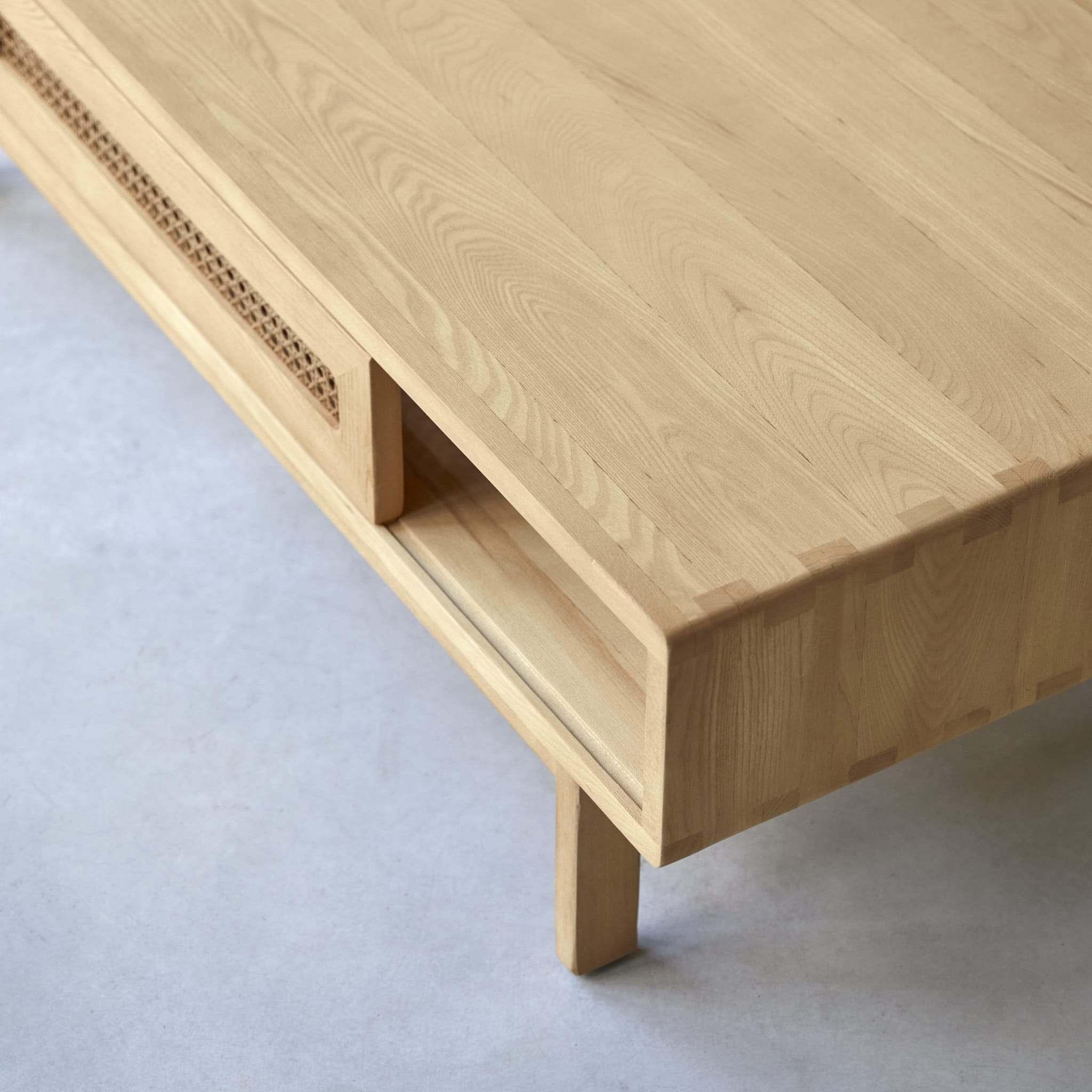 Tikamoon Luis coffee table in solid elm with canework detailing, rear view