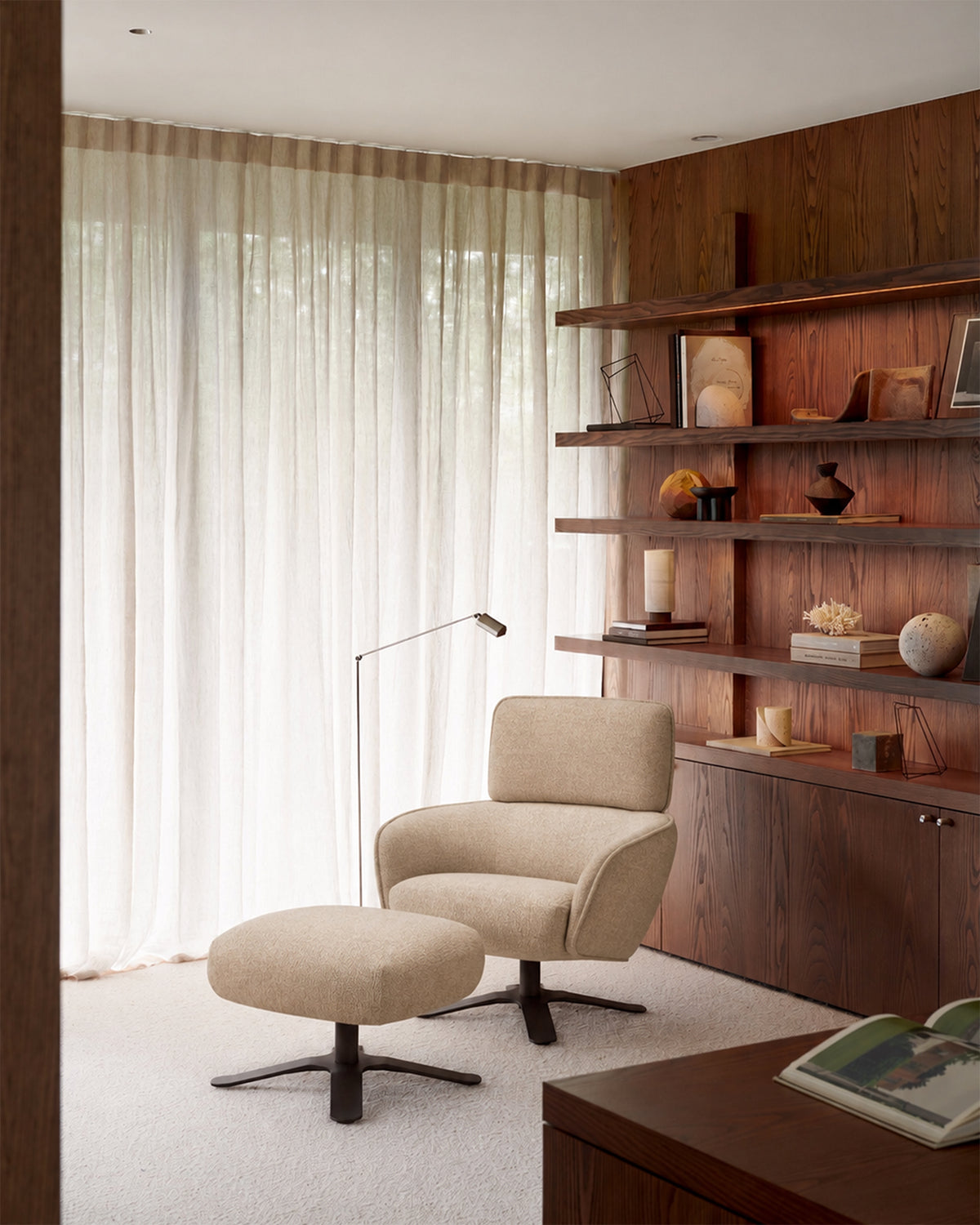 Ethnicraft Merge Lounge Chair and footstool in Loam, styled in a living room, recycled-content fabric