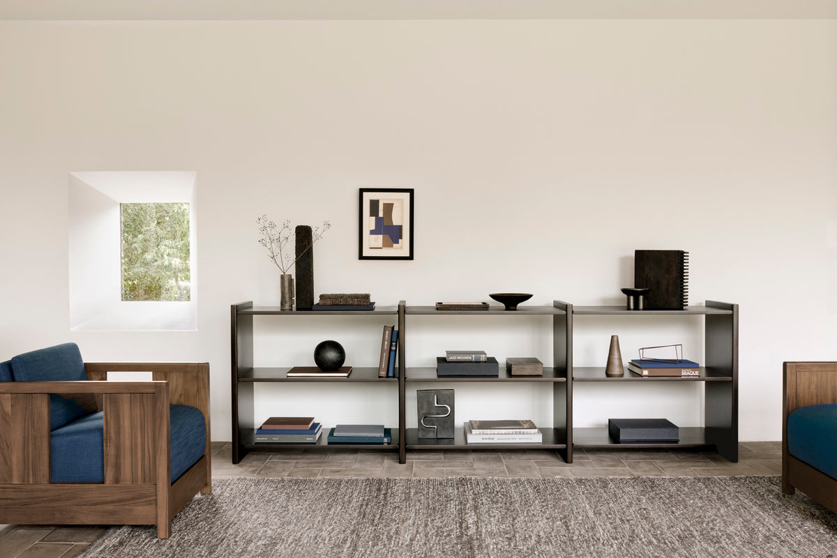 Ethnicraft Mortise Rack with Roan lounge chair, styled in an interior setting, solid mahogany