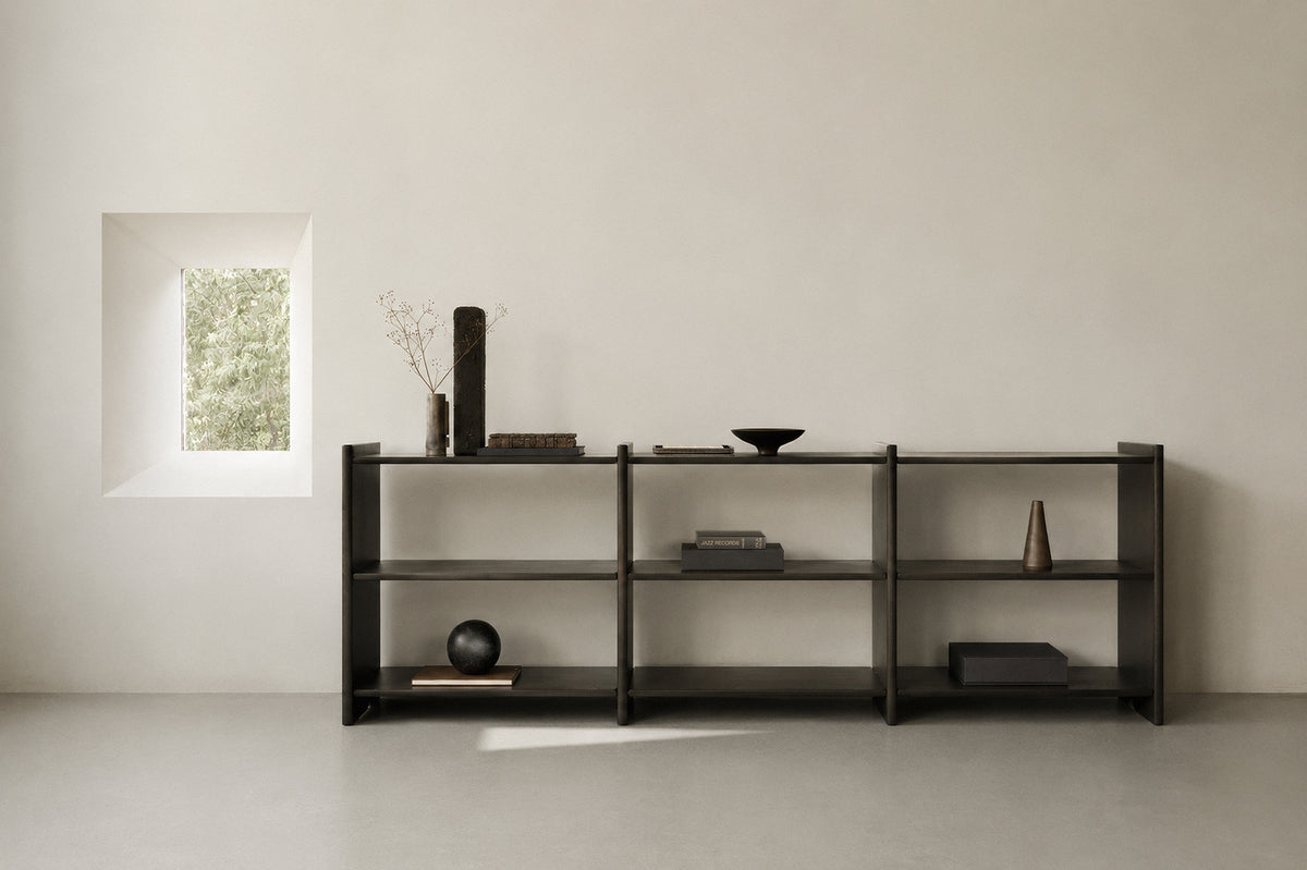Ethnicraft Mortise Rack in Rose Brown, styled in a living room, solid mahogany
