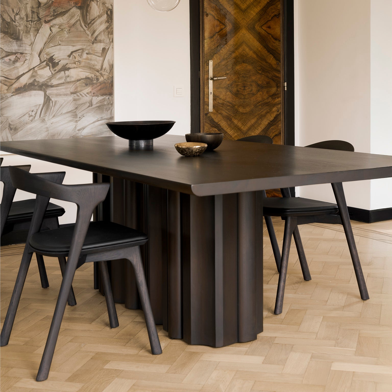 Ethnicraft Sequence Dining Table in mahogany styled in a dining room