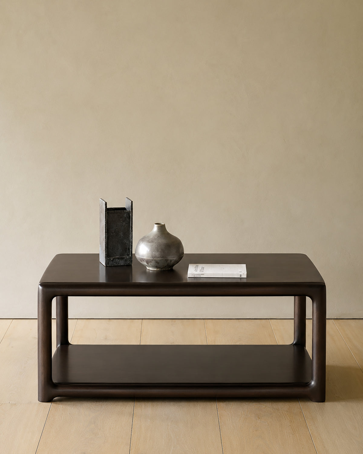 Ethnicraft Eda Coffee Table square in Rose Brown, styled in an interior setting, solid mahogany