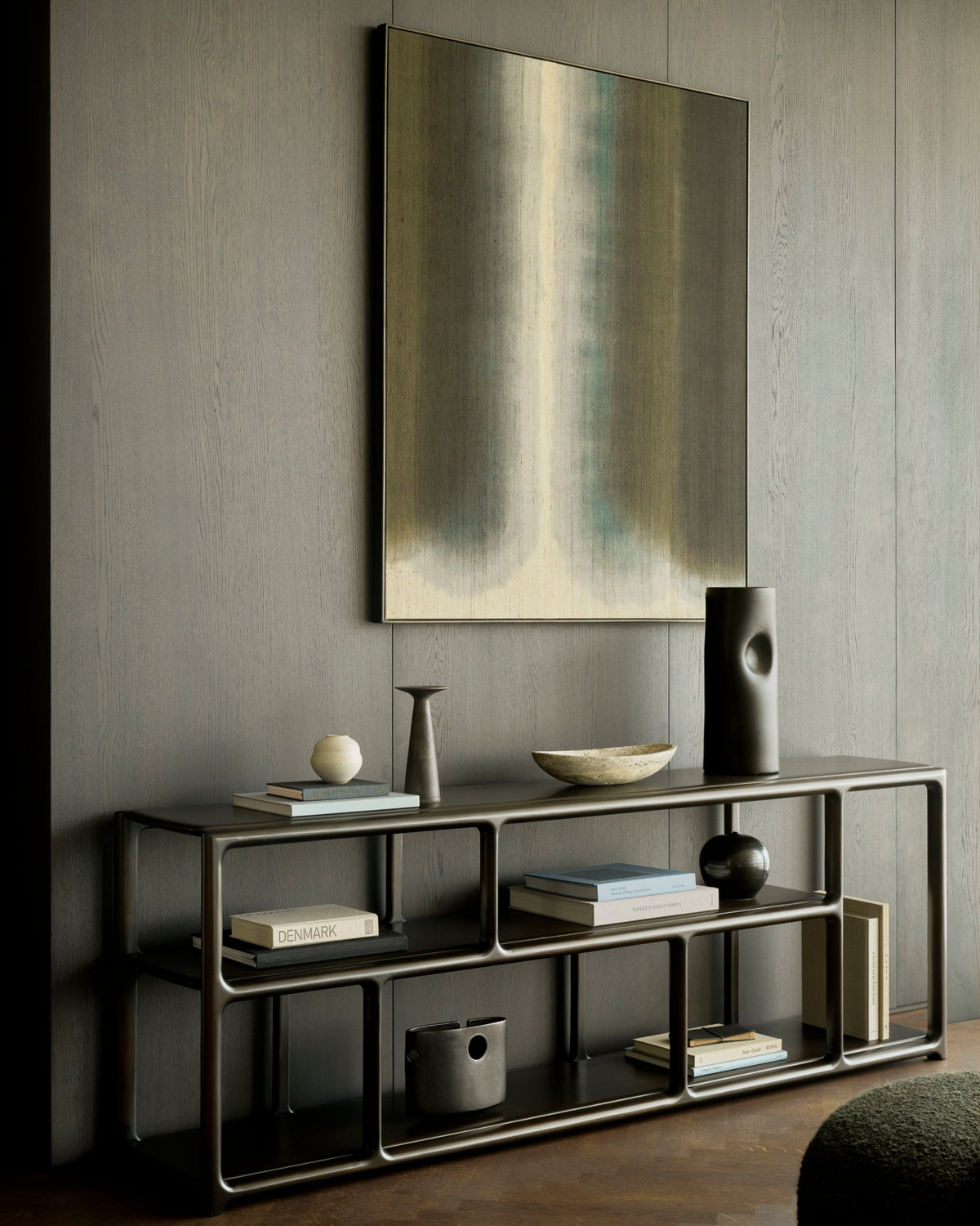 Ethnicraft Eda Rack low in Rose Brown with Orb pouf, styled in a living room, solid mahogany
