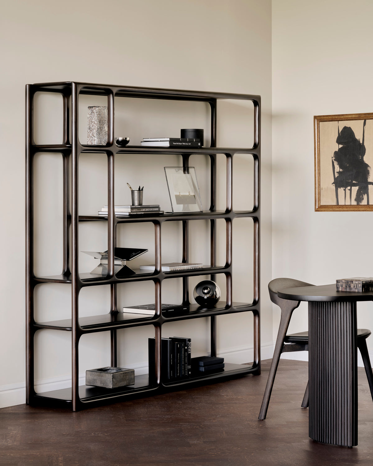Ethnicraft Eda Rack tall in Rose Brown with Bok dining chair, styled in an interior setting, solid mahogany