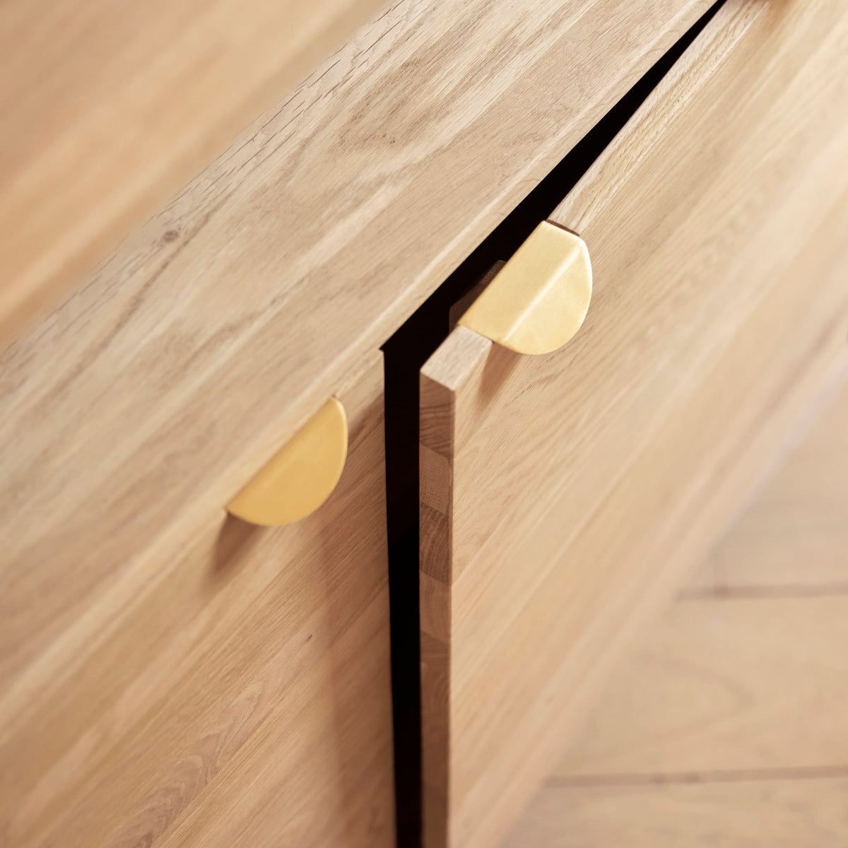 Tikamoon Pola oak sideboard, detail of the slanted legs