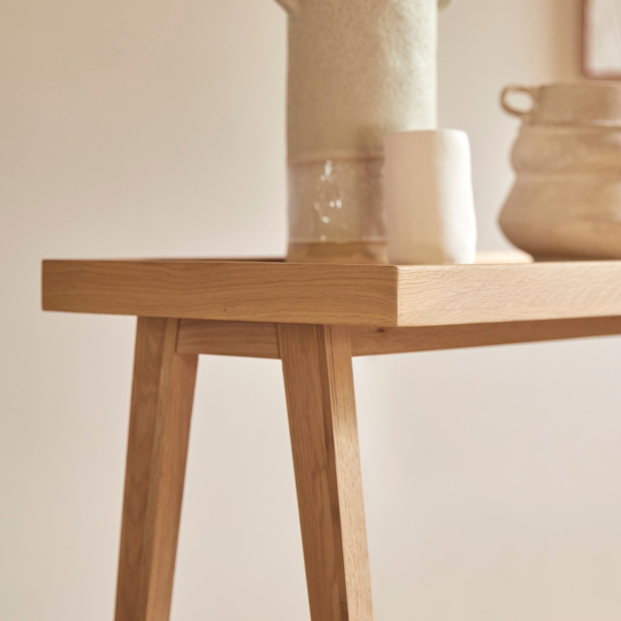 Tikamoon Pola console table in solid oak, side view