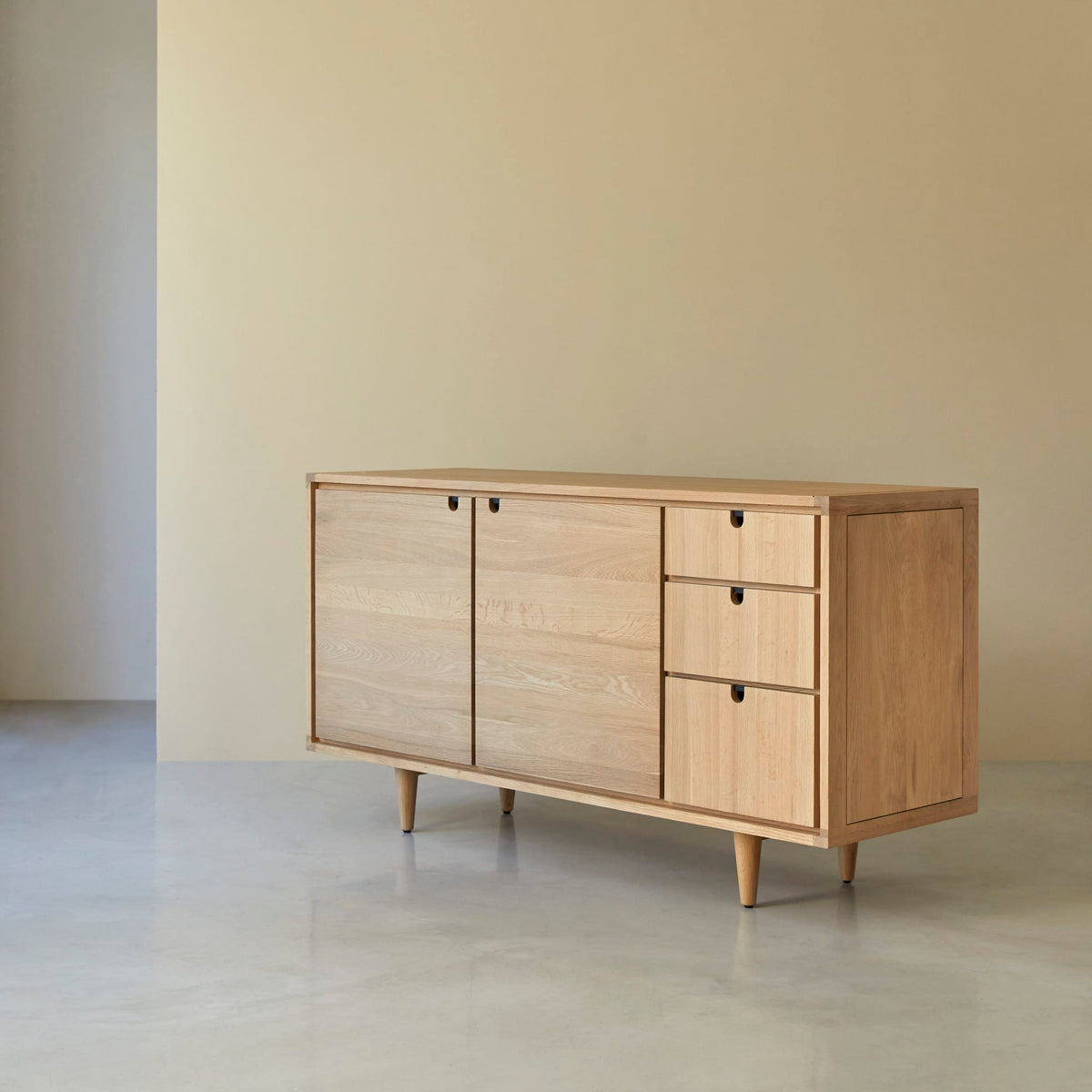 Tikamoon Jonàk sideboard in solid oak, detail of the base