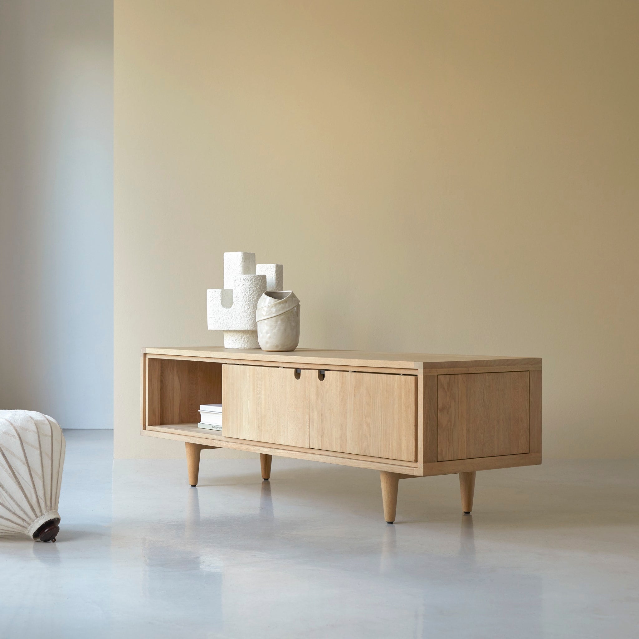 Tikamoon Jonàk TV stand in solid oak, angled view