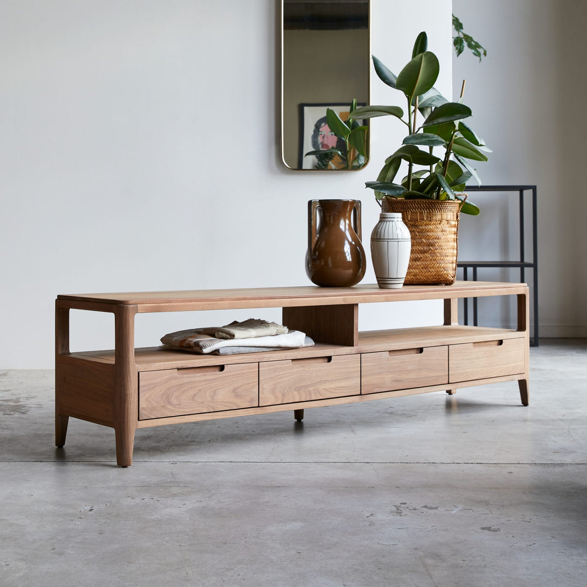 Tikamoon Arto TV stand in solid walnut, three-quarter view