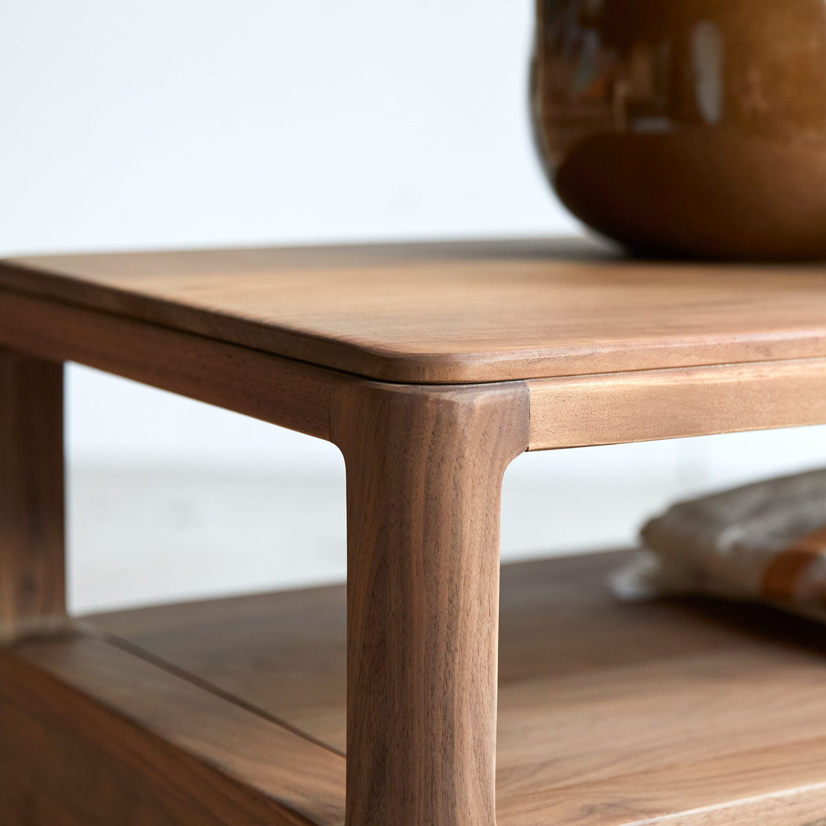 Tikamoon Arto TV stand in solid walnut, close-up of the walnut grain