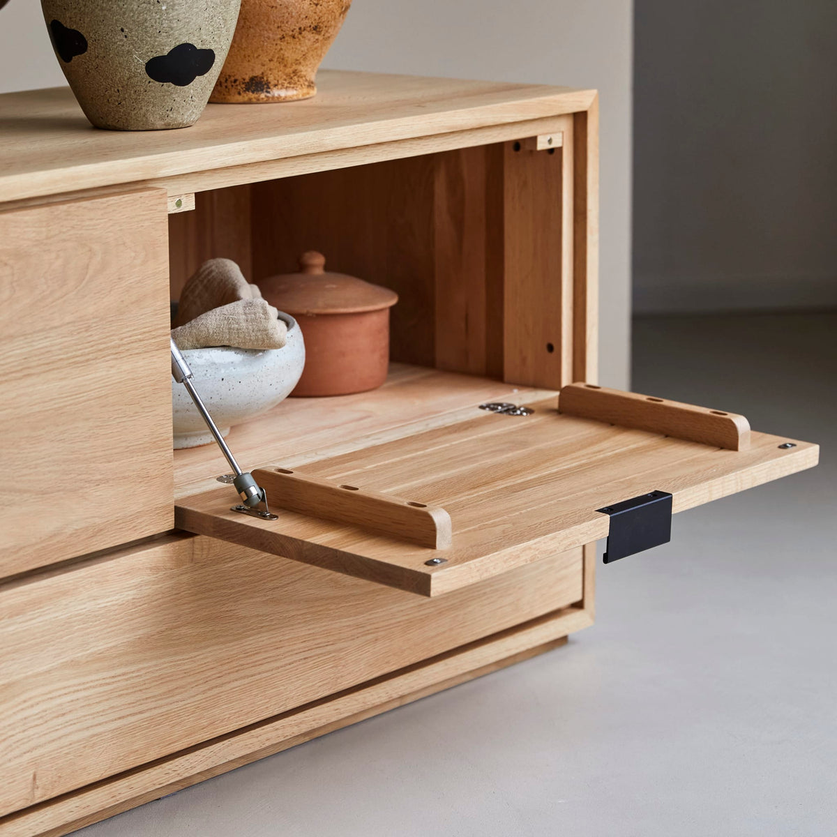 Senson oak TV stand with a drop-down door open