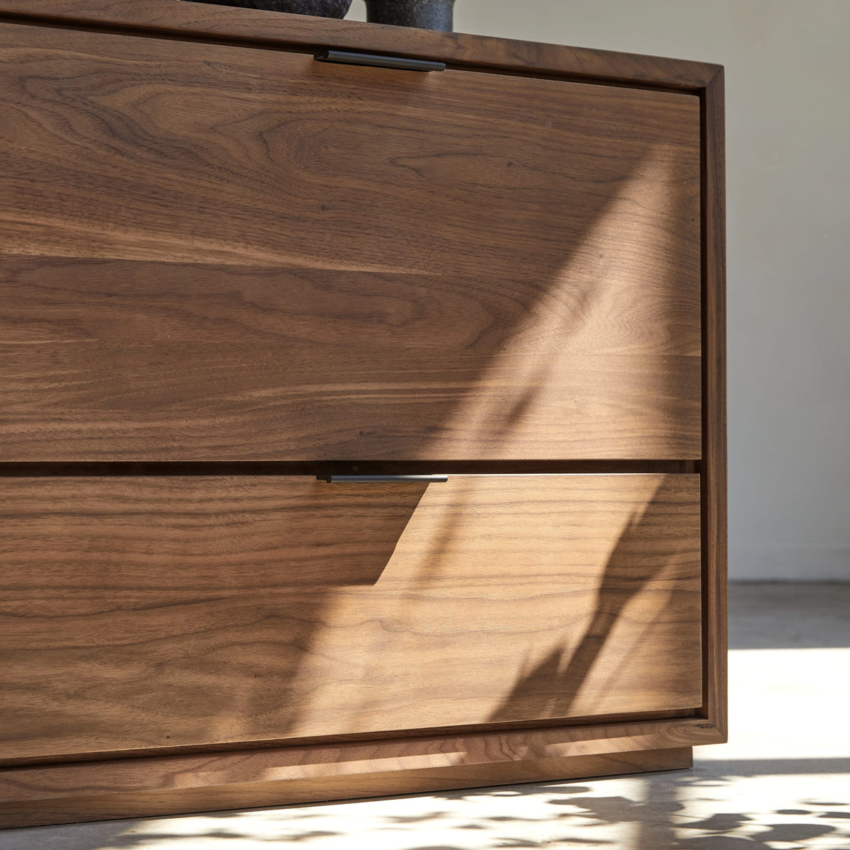 Tikamoon Senson TV stand in solid walnut, three-quarter view