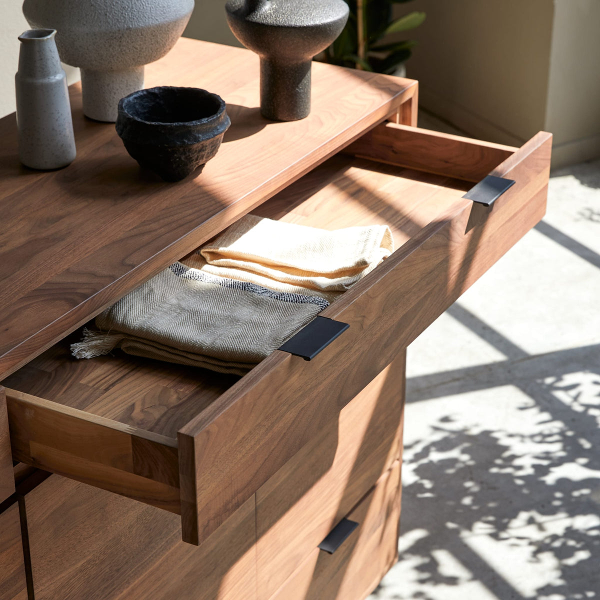 Tikamoon Senson sideboard in solid walnut, detail of a drawer front