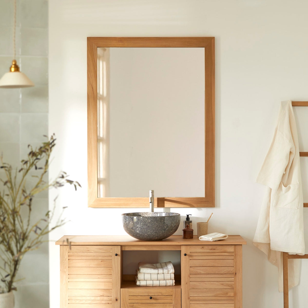 Tona teak mirror hung horizontally in a bathroom