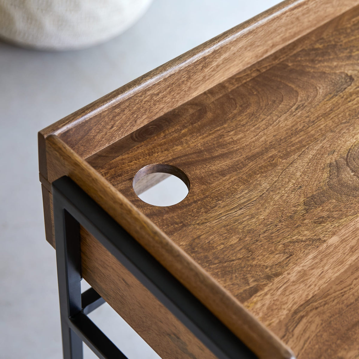 Tikamoon Hedda desk in solid mango and metal, top-down view of the desk surface